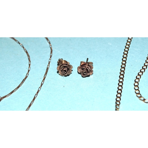 565 - A 9ct gold neck chain, 50.5cm, another, 51cm and a pair of 9ct gold rose ear studs, total weight 4.7... 