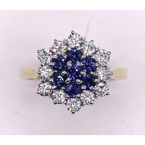 591 - A sapphire and diamond ring claw-set a cluster of seven round-cut sapphires and twelve brilliant-cut... 