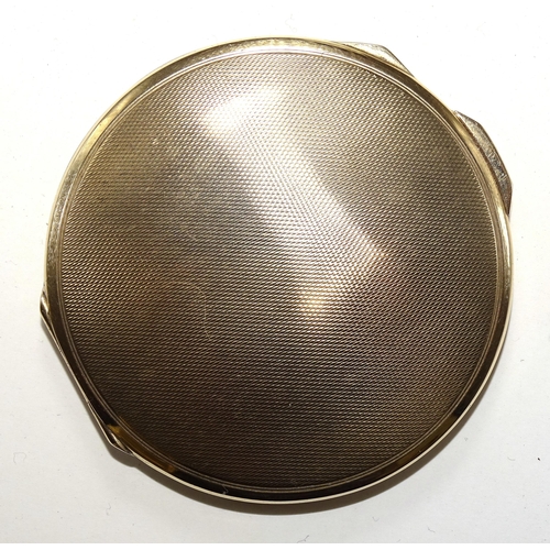 597 - An engine-turned 9ct gold compact by Mappin & Webb, hallmarked Birmingham 1939, 66mm diameter, g... 