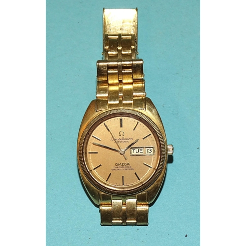 688 - Omega, a gentleman's Constellation Automatic 18ct gold wristwatch, the brushed gold dial with black ... 