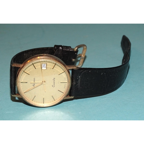 703 - Hermes, a gentleman's 9ct gold-cased 'Quartz' wristwatch, the gilt face with baton numerals and date... 