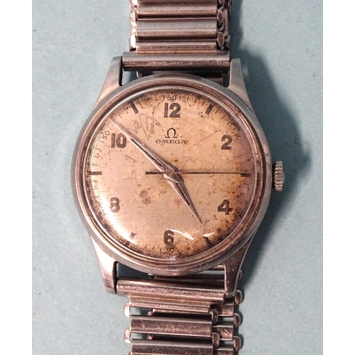 704 - Omega, a gentleman's steel-cased wristwatch, the 32mm silvered dial, (discoloured), with Arabic and ... 