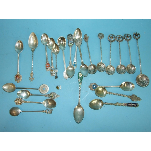 742 - A collection of twenty-three foreign silver and white metal souvenir teaspoons.