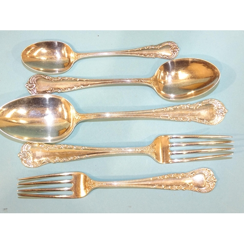 771 - A canteen of sterling silver cutlery by J A Merrill & Co, twelve each, tablespoons, dessert spoo... 