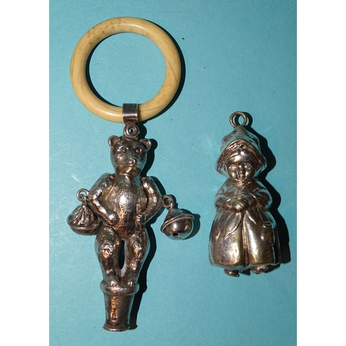 914 - A silver baby's rattle in the form of a teddy bear with bells at his elbows and bone teething ring, ... 