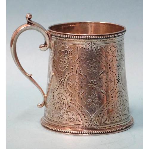 916 - A Victorian silver christening tankard of tapered form, with engraved decoration, (no inscription) a... 