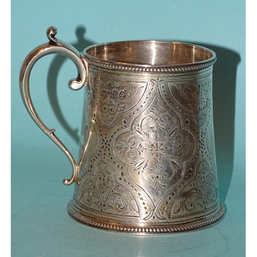 916 - A Victorian silver christening tankard of tapered form, with engraved decoration, (no inscription) a... 