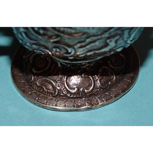 917 - A Continental silver pill box in the form of a worktable, on cabriole legs, with embossed decoration... 