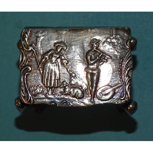 917 - A Continental silver pill box in the form of a worktable, on cabriole legs, with embossed decoration... 