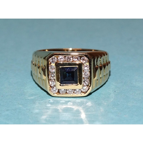 434 - A sapphire and diamond cluster ring set a square-cut sapphire within a border of sixteen channel-set... 