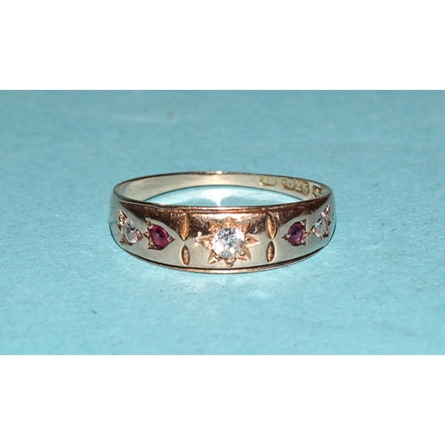 567 - A 15ct gold gypsy ring set three diamonds and two rubies, size K, 1.8g.