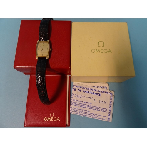 684 - Omega, a gentleman's 9ct gold tonneau-cased De Ville wristwatch, the gold face with baton numerals, ... 