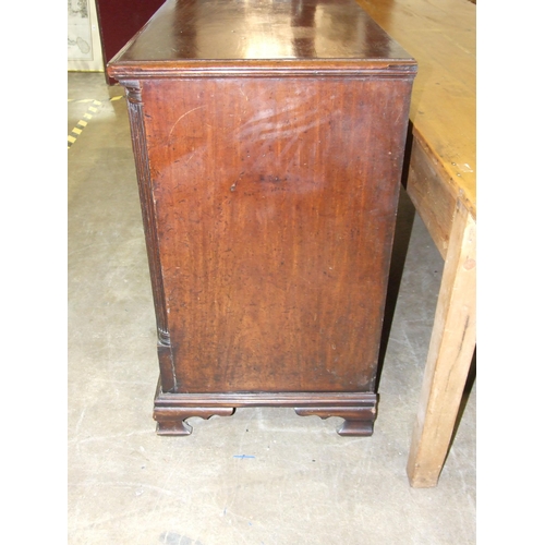 15 - A large Georgian mahogany dresser base, the top with moulded and inlaid edge above a pair of central... 