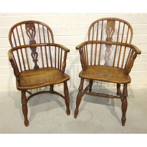 20 - A 19th century yew wood and elm comb-back Windsor chair with crinoline stretcher and another elm Win... 