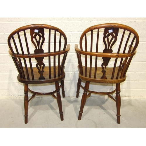 20 - A 19th century yew wood and elm comb-back Windsor chair with crinoline stretcher and another elm Win... 