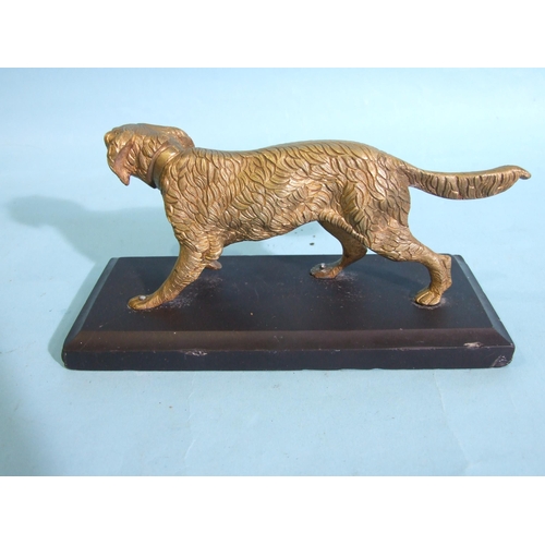 228 - A gilt metal figure of a sporting dog, on black marble base, 20cm long, 8cm high, the base 25 x 9cm.... 