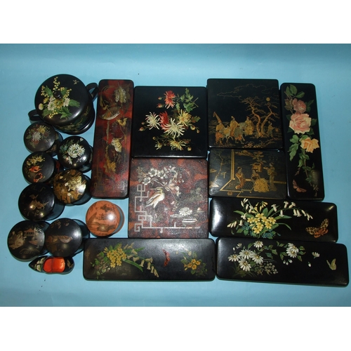 240 - A collection of approximately 25 pieces of early-20th century lacquered wood and papier-mâché boxes,... 