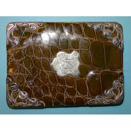 253 - An Art Nouveau silver-mounted green crocodile skin wallet, Birmingham 1900, 14 x 10cm.... 