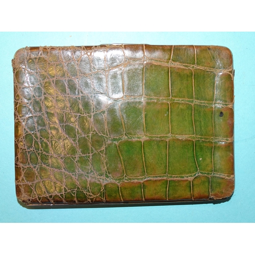 253 - An Art Nouveau silver-mounted green crocodile skin wallet, Birmingham 1900, 14 x 10cm.... 