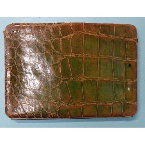 253 - An Art Nouveau silver-mounted green crocodile skin wallet, Birmingham 1900, 14 x 10cm.... 