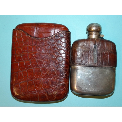 255 - A crocodile skin cigar case, 15.5 x 11.5cm (closed) and a silver-plated and crocodile skin-mounted g... 