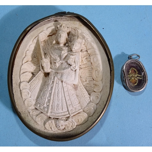 257 - A plaster seal depicting the Virgin Mary holding baby Jesus with crowns and sceptre, in base metal f... 