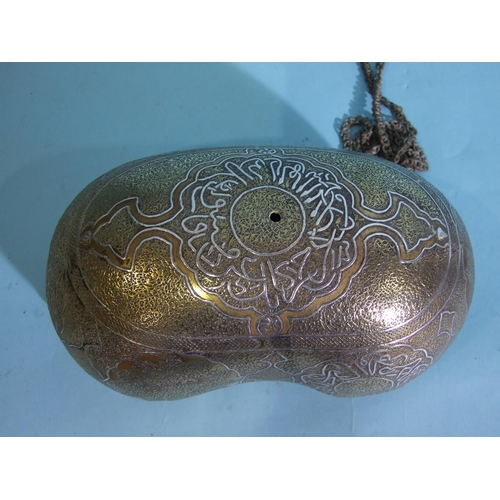 267 - A Middle Eastern silver inlaid brass kashkul of coco-de-mer form, complete with chain, 21 x 10cm, (h... 