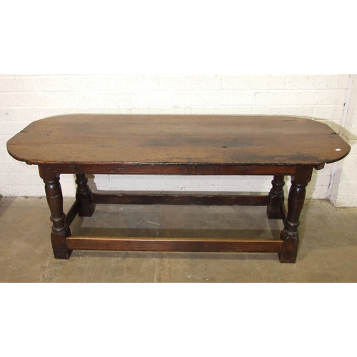 27 - An antique oak farmhouse table, (repaired, altered and feet blocked), 203 x 80cm.
