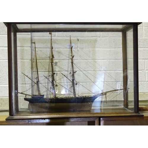 271 - A model of a three-masted barque, with standing and running rigging, anchor and ship's boats, 55 x 3... 