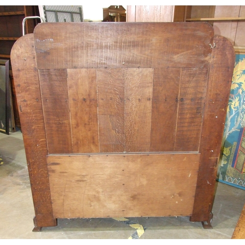 28 - An early-20th century Arts & Crafts oak dining table, the plank top above a single frieze drawer... 