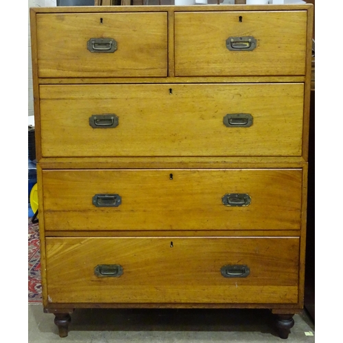 29 - A teak military chest of two short and three long drawers, on turned feet, 97cm wide, 123.5cm high, ... 