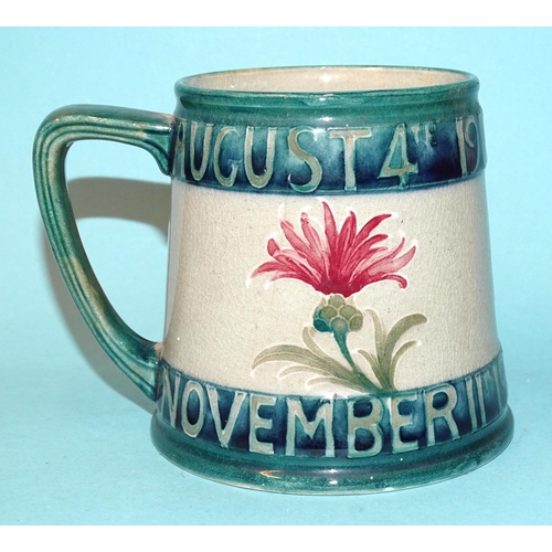 295 - Arthur Lasenby Liberty and William Moorcroft, a commemorative 1919 'Peace' mug, impressed maker's ma... 