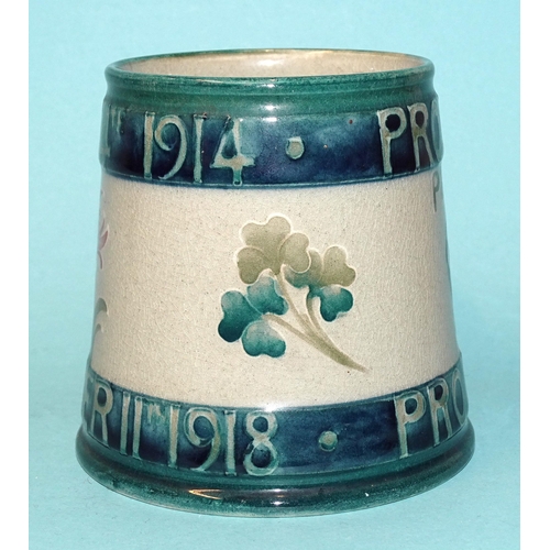 295 - Arthur Lasenby Liberty and William Moorcroft, a commemorative 1919 'Peace' mug, impressed maker's ma... 