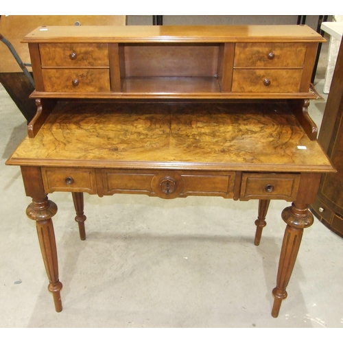 3 - A late-19th century Continental walnut dressing table, the superstructure with four small drawers, a... 