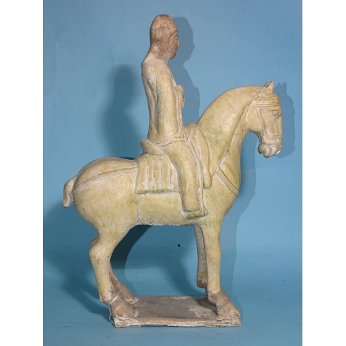 342 - A Chinese Tang Dynasty-style pottery figure of a horse and rider, 33cm high.