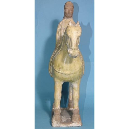 342 - A Chinese Tang Dynasty-style pottery figure of a horse and rider, 33cm high.