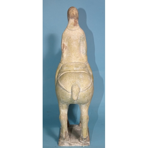 342 - A Chinese Tang Dynasty-style pottery figure of a horse and rider, 33cm high.