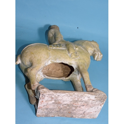 342 - A Chinese Tang Dynasty-style pottery figure of a horse and rider, 33cm high.