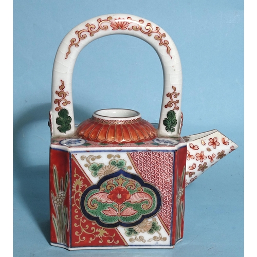 343 - A Japanese Imari porcelain sake kettle with overhead handle c1900.