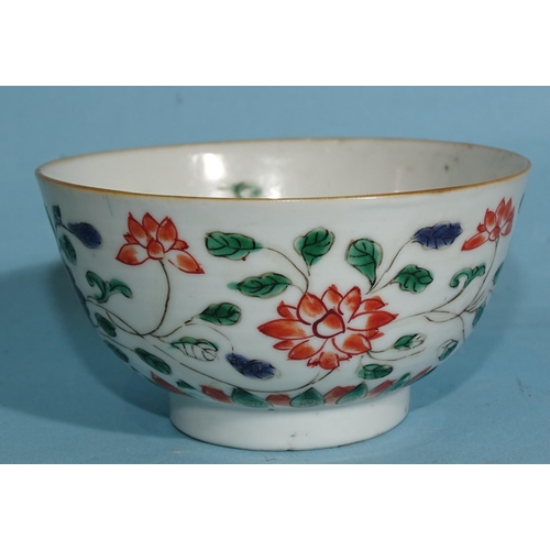 354 - A Chinese Kang Hsi period famille verte tea bowl decorated with flowering lotus plants.... 