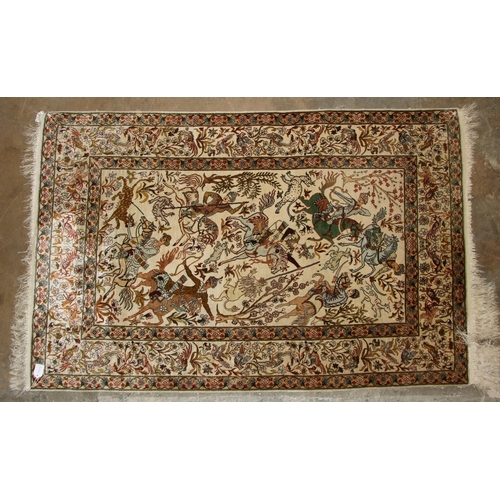 42 - A mid-20th century Persian silk pictorial rug, centrally decorated with figures on horseback hunting... 