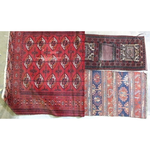 43 - A Persian saddlebag, 51 x 103cm, an antique carpet fragment sewn as a saddlebag, 58 x 94cm and a dam... 