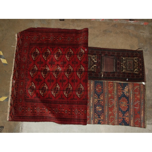 43 - A Persian saddlebag, 51 x 103cm, an antique carpet fragment sewn as a saddlebag, 58 x 94cm and a dam... 