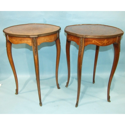 8 - A pair of reproduction inlaid walnut occasional tables in the French taste, with gilt metal mounts, ... 