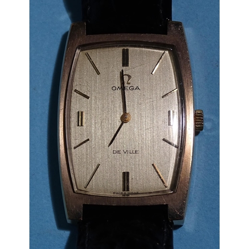 684 - Omega, a gentleman's 9ct gold tonneau-cased De Ville wristwatch, the gold face with baton numerals, ... 