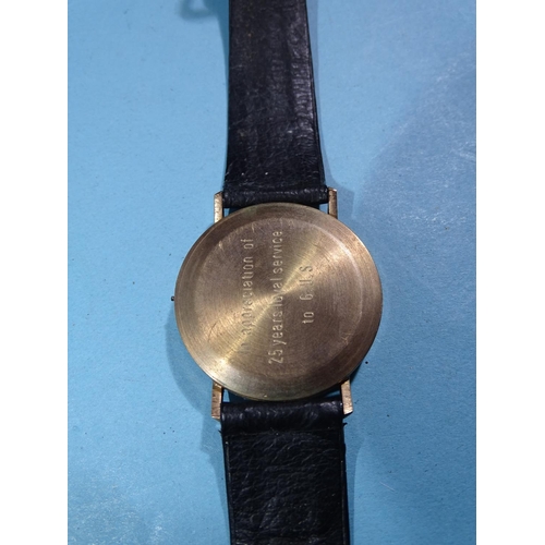 703 - Hermes, a gentleman's 9ct gold-cased 'Quartz' wristwatch, the gilt face with baton numerals and date... 