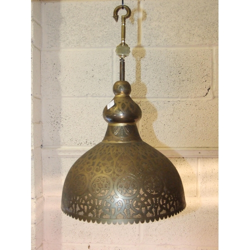 276 - A large Egyptian pierced metal hanging light bowl with extension hook, 70cm high approximately, 46cm... 