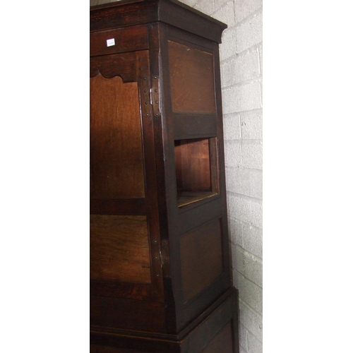 6 - An antique oak cupboard, having a pair of panelled doors above seven drawers, 110cm wide, 190cm high... 