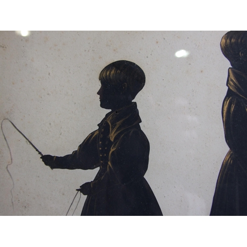 225 - A pair of 19th century silhouettes, family groups, the first depicting a central female figure surro... 