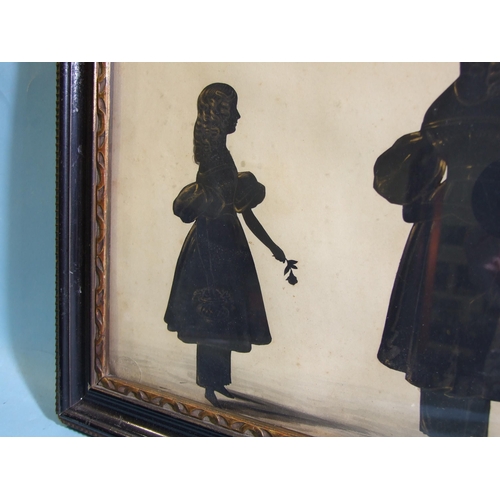 225 - A pair of 19th century silhouettes, family groups, the first depicting a central female figure surro... 